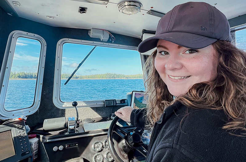 Kyla MacIlroy driving a boat