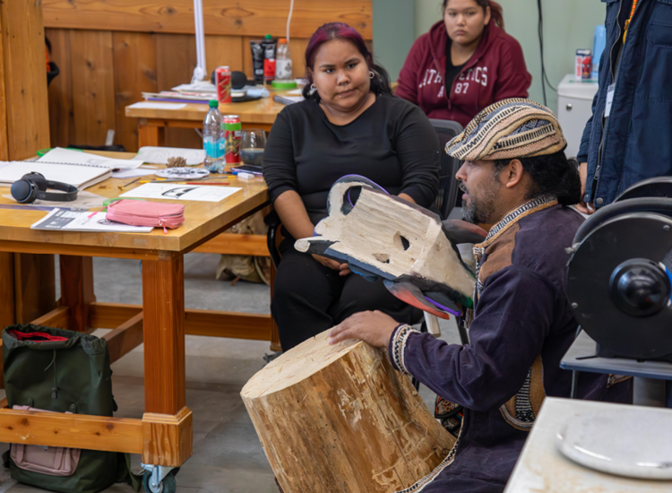 Harol speaks to students in the First Nations Fine Arts program about Bruncajc craving techniques